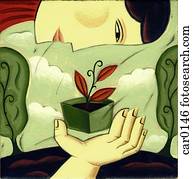 A woman looking at a seedling A woman looking at a seedling