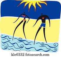 A man and woman walking into the water at the beach A man and woman walking into the water at the beach