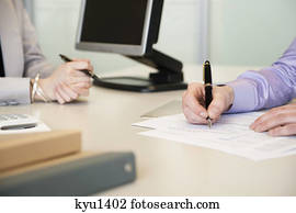 Man signing documents