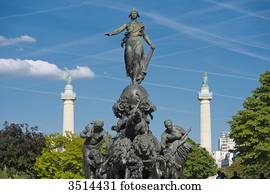 France. Paris 11th district. Place of the Nation. The statue  The triumph of the Republic  by Jules Dalou ( 1899 ). In the background: 2 columns by Claude Nicolas Ledoux in the entrance of the Cours de Vincennes ( 1787 )