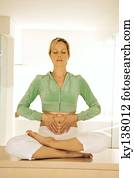 Young woman in yoga position