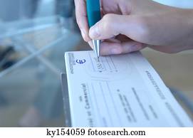 Business person making out check