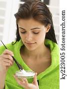 Close-up of a woman mixing hair color