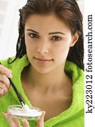 Portrait of a woman mixing hair color