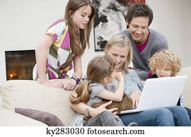 Family using a laptop