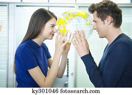 Business couple romancing in an office