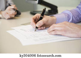 Man signing documents