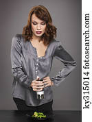 Young woman seasoning vegetables