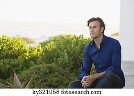 Mid adult man thinking