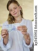 Girl holding money