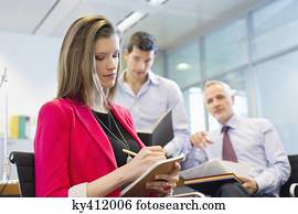 Business executives working in an office Business executives working in an office