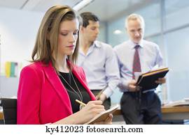 Business executives working in an office Business executives working in an office