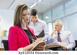 Business executives working in an office Business executives working in an office