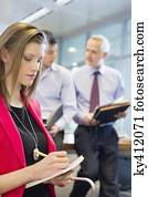 Business executives working in an office Business executives working in an office