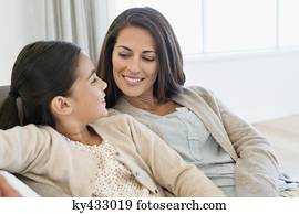 Mother and daughter smiling at each other