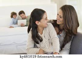 Mother and daughter smiling at each other