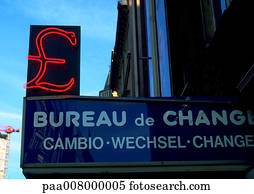 Foreign Exchange Office sign in French with neon pound sign