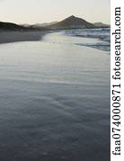 Waves lapping onto beach