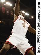 Basketball player jumping in air, low angle view