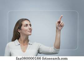 Woman using large transparent touch screen