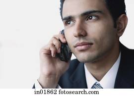 Young businessman using mobile phone, head shot Young businessman using mobile phone, head shot