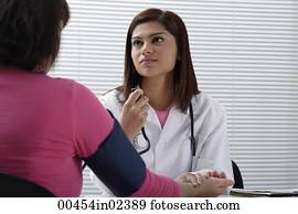 Doctor taking pulse of patient Doctor taking pulse of patient