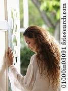 Profile of woman with long hair in doorway
