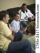 Friends playing cards at home