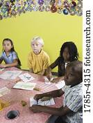 Children drawing and paying attention in class