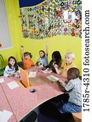 Children drawing and paying attention in art class