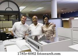 office workers posing equipment formation male female