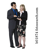 Businessman and a businesswoman looking over paperwork