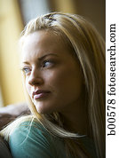 Close-up of a young woman looking over her shoulder