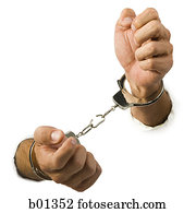 Close-up of hands trying to break out of handcuffs