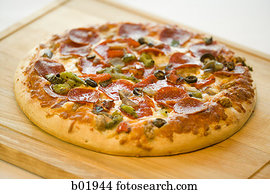 High angle view of a pizza on a cutting board