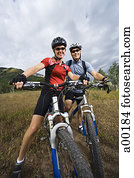 Low angle view of a couple mountain biking