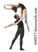 Male ballet dancer supporting a female ballerina
