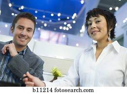 Casual male and female business acquaintances