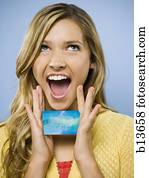 Excited woman with credit card