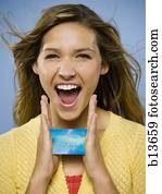 Excited woman with credit card