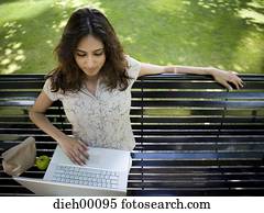 Woman on a laptop outside