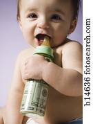 Baby drinking from bottle with US currency in it