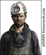 Mine worker with flashlight helmet