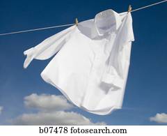 White cotton shirt hanging on a clothesline