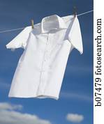 White cotton shirt hanging on a clothesline