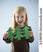 little girl with a paper cutout