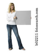 Portrait of a young woman holding a blank sign