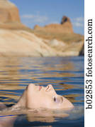 Profile of a young woman in a lake