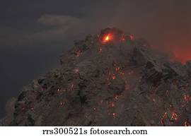 Glowing summit of Rerombola lava dome of Paluweh volcano.