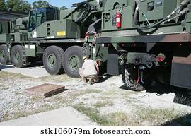 U.S. Marine works on a Kalmar Rough Terrain vehicle.